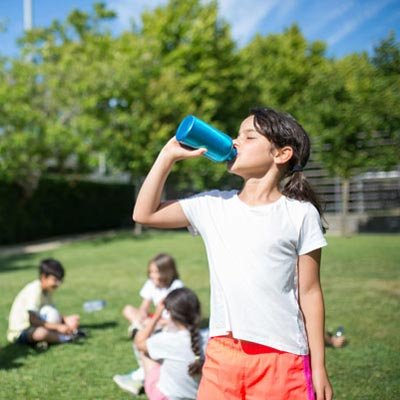 Student drinking water from bottle