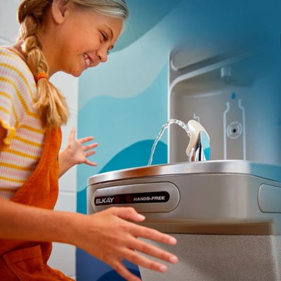 student using touchless water fountain