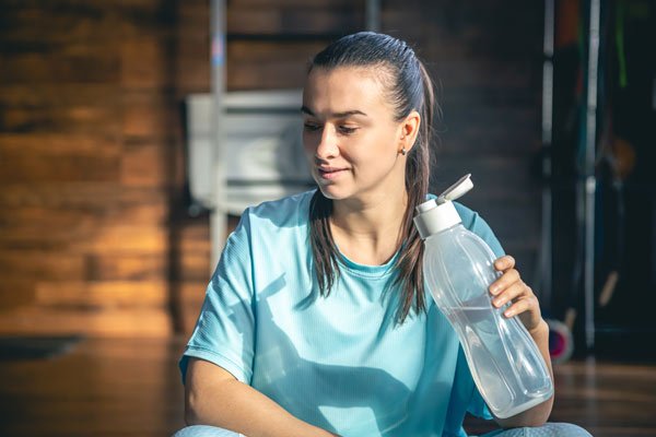 person drinking water in hospital